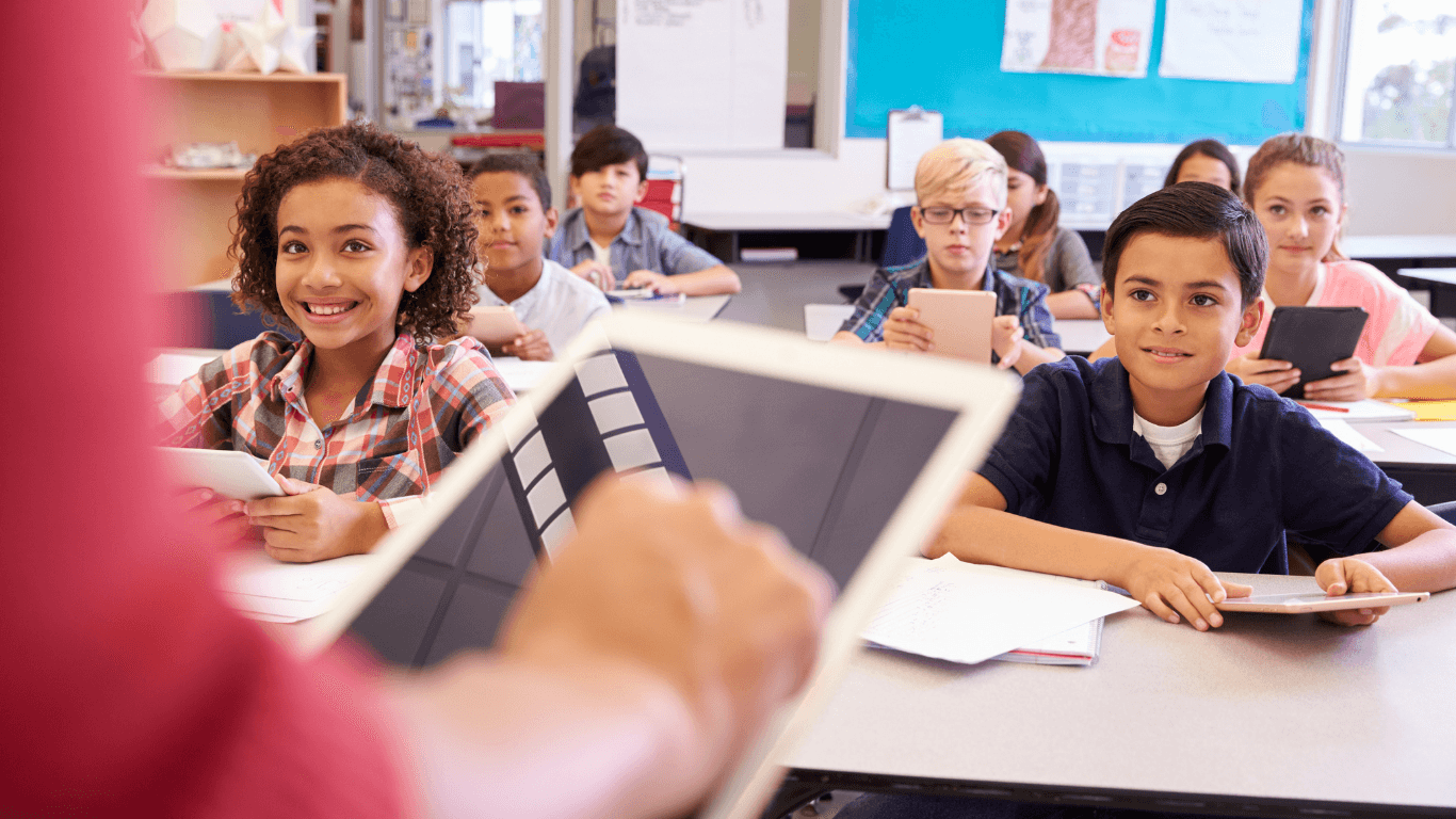 Students in class with tablets — ROI of school equipment management with Fleezy