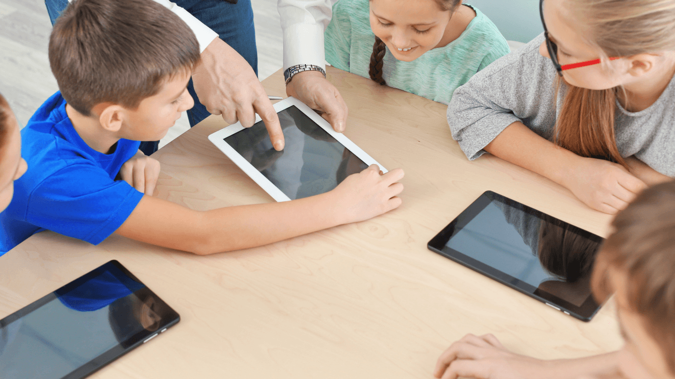 Students using digital tablets in class — QR Code tracking with Fleezy