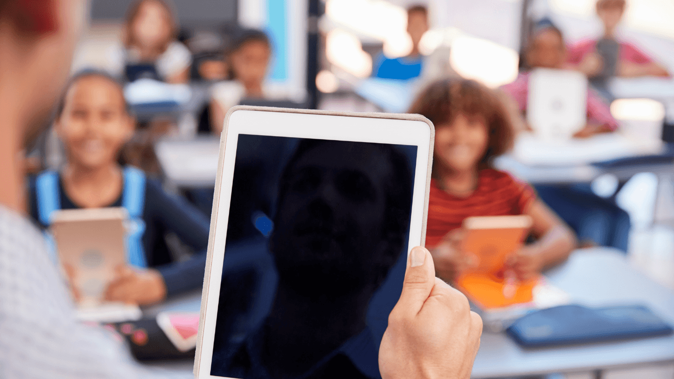 School principal reviewing the school inventory on a tablet